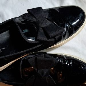 Women's Micheal Kors patent leather slip on type gymshoe size 7